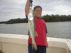 Snook caught by 9 yr. old boy fishing with dad - Marco Island Fishing Charters