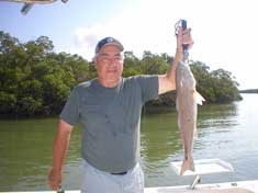Big Don from Idaho and a great Red fish caught on live bait in Addison Bay - Marco Island Fishing Charters