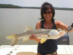 Tara with a nice Snook caught will fishing the outer creeks of Palm Bay - Marco Island Fishing Charters