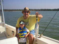 This young gentleman landed this trout with a little help from dad out on Cape Romano flats - Marco Island Fishing Charters