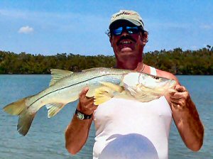 Charter Fishing Marco Island Boat Captain Michael Van Jones hooking yet another one off the shores of Marco Island